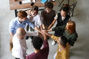 pexels-photo-3184436-3184436 Top view of diverse group of people collaborating in office setting.